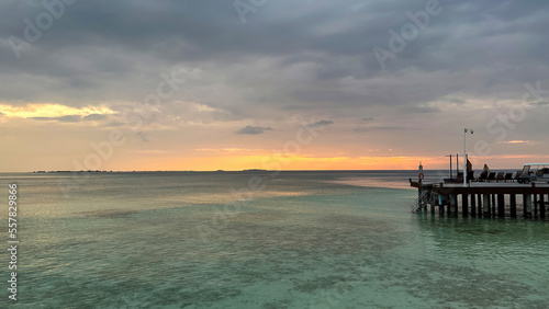 Beautiful Tropical sunset landscape in Maldives island Baa   with infinity Indian ocean sea water view and cloudy skies   perfect relaxing Honeymoon travel destination 