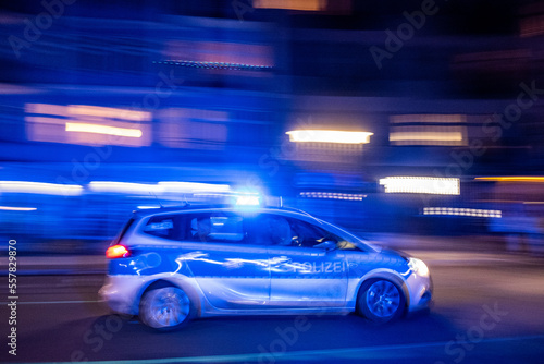  Patrol car of the Berlin police drives with blue lights to a mission through Oderberger Straße in Berlin-Prenzlauer Berg on New Year's Eve.
