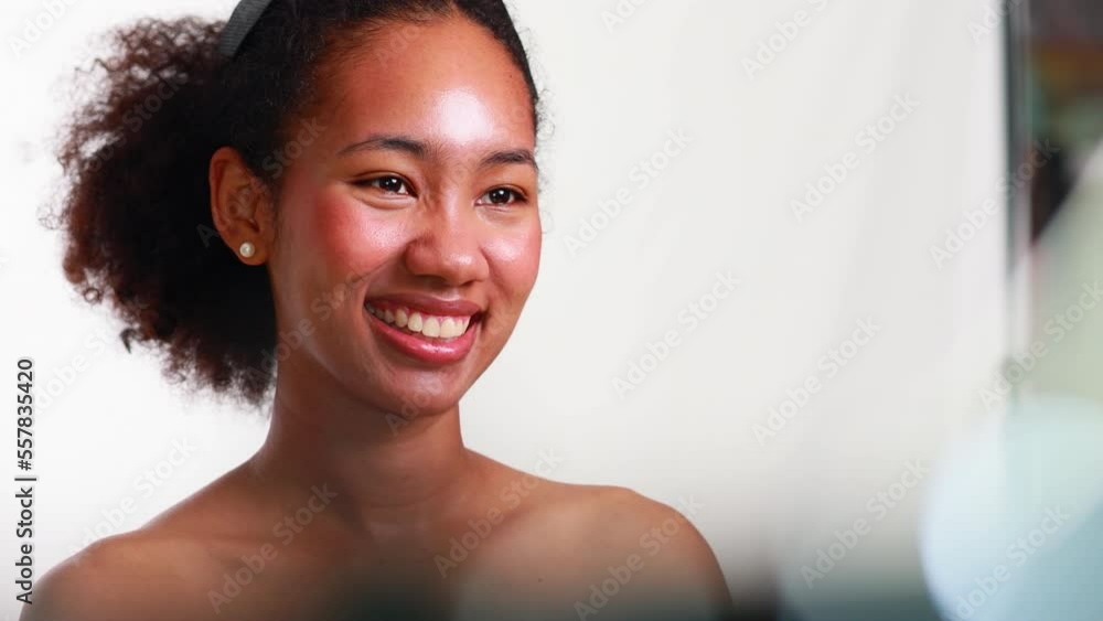 Beautiful portrait african american girl with clean healthy skin and afro hairstyle smiling isolated on white studio background. Beautiful portrait african american girl with clean healthy skin and afro hairstyle smiling isolated on white studio background.