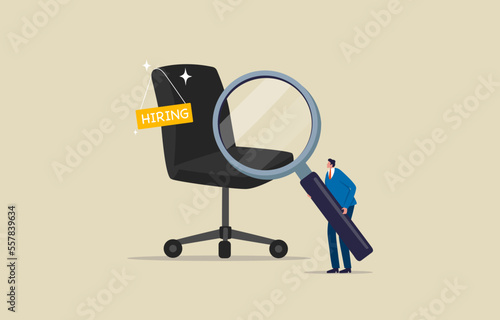 Job Search, employment, career, candidates, companies, applying for a job. Businessman with magnifying glass searching for vacancies.