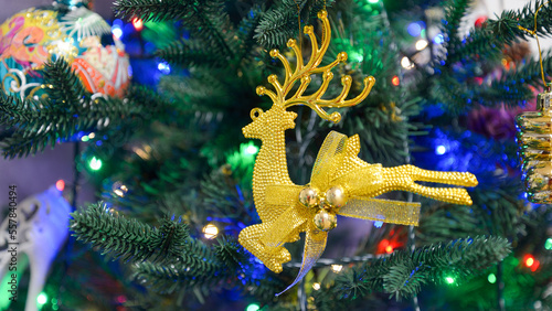 Decoration of the New Year tree with Christmas tree toys, background.