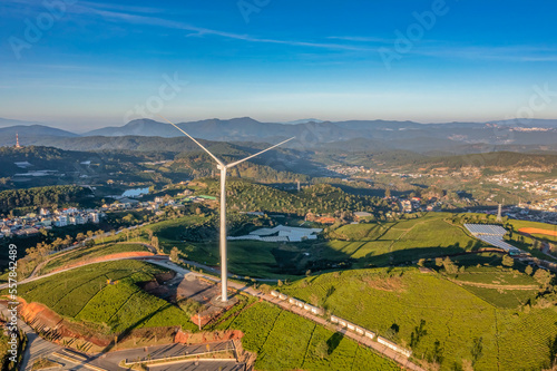 PANORAMIC VIEW OF WIND FARM OR WIND PARK, WITH HIGH WIND TURBINES FOR GENERATION ELECTRICITY WITH COPY SPACE. GREEN ENERGY CONCEPT, CAU DAT, DA LAT, VIETNAM