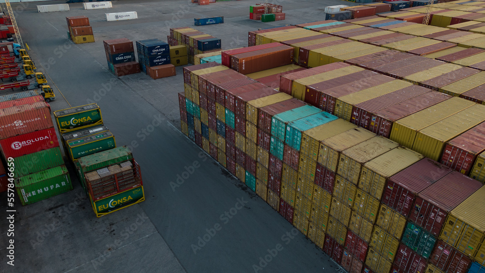 Fototapeta premium Aerial image of logistics platform with containers to import and export materials by ship 