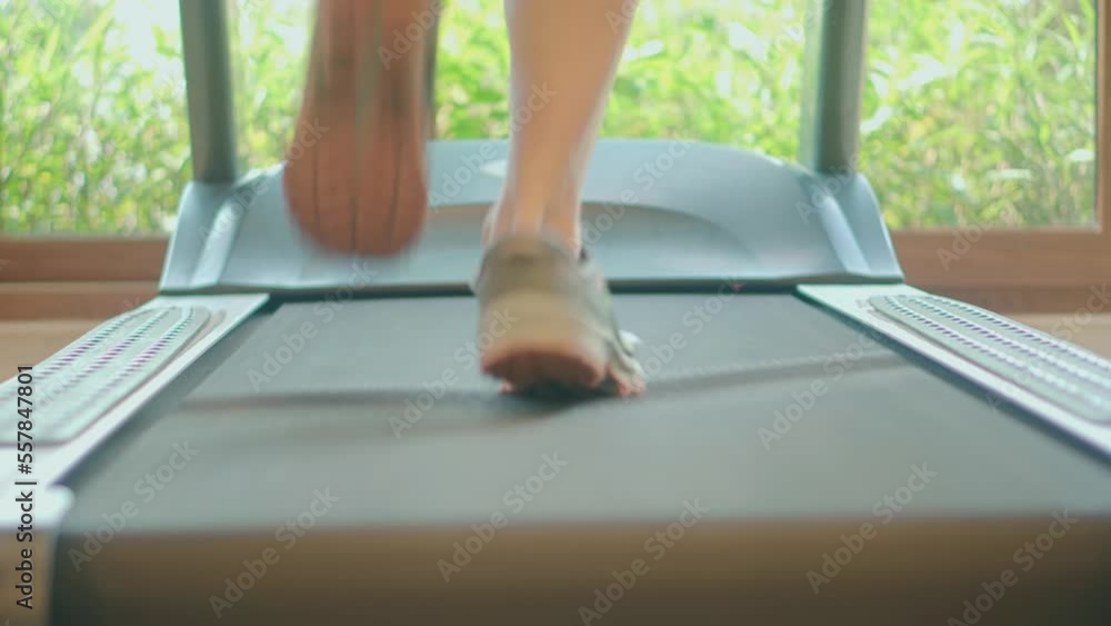 treadmill running in gym. legs on treadmill exercise machine treadmill running in gym. legs on treadmill exercise machine