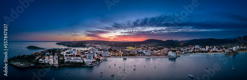 Spain, Balearic Islands, Santa Ponsa, Mallorca, Aerial panorama of seaside town at dusk photo