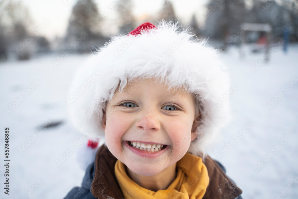 Happy cute boy wearing Santa hat Happy cute boy wearing Santa hat