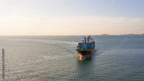 Aerial view container cargo ship, import export commerce global business trade logistic and transportation of worldwide by container cargo ship boat in the open sea, Freight shipping maritime.