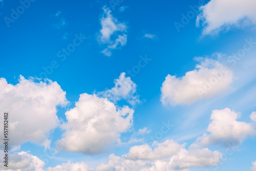 Blue sky with white cumulus clouds moving fast in day light. Cloudscape. Nature background. Windy weather forecast. Religion concept. Heaven landscape. Fresh air. Morning inspiration. Daylight