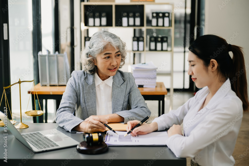 business people and lawyers discussing contract papers sitting at the table. Concepts of law, advice, legal services. business people and lawyers discussing contract papers sitting at the table. Concepts of law, advice, legal services.