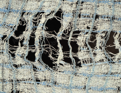 A worn out and ragged fabric cloth in closeup