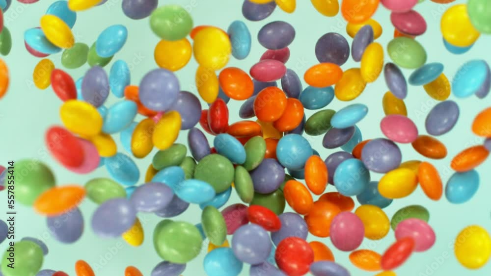 Super slow motion of flying candies up in the air. Camera in super fast motion. Filmed on high speed cinema camera, 1000 fps, placed on high speed cine bot. Super slow motion of flying candies up in the air. Camera in super fast motion. Filmed on high speed cinema camera, 1000 fps, placed on high speed cine bot.