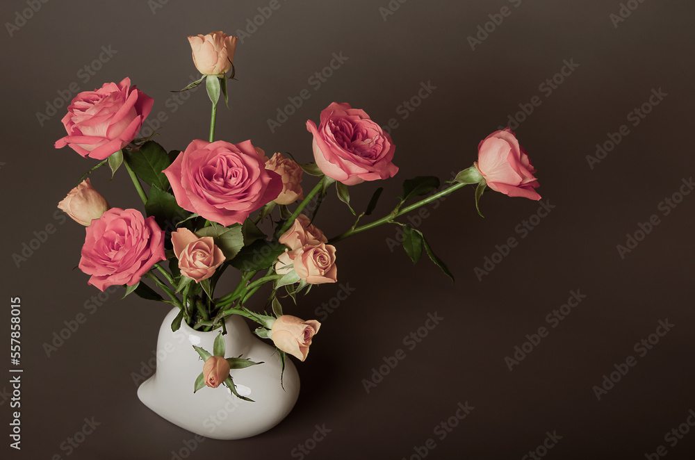 Beautiful bouquet of roses on a brown and gray background for congratulations Beautiful bouquet of roses on a brown and gray background for congratulations
