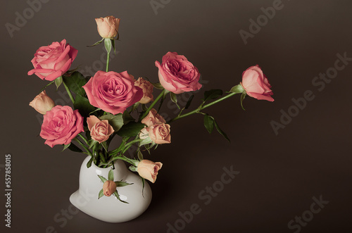 Beautiful bouquet of roses on a brown and gray background for congratulations