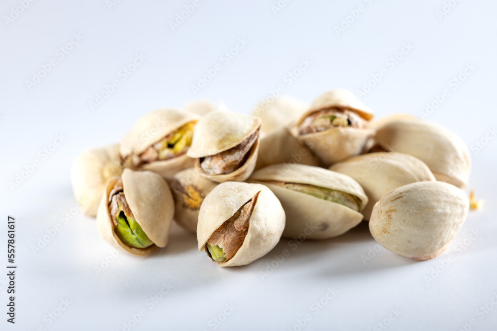 Pile of salted pistachios on white Pile of salted pistachios on white