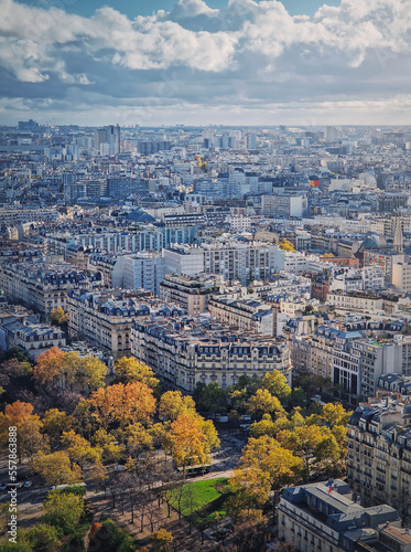 Paris cityscape vertical view from the Eiffel tower height, France. Fall season scene with colored trees © psychoshadow