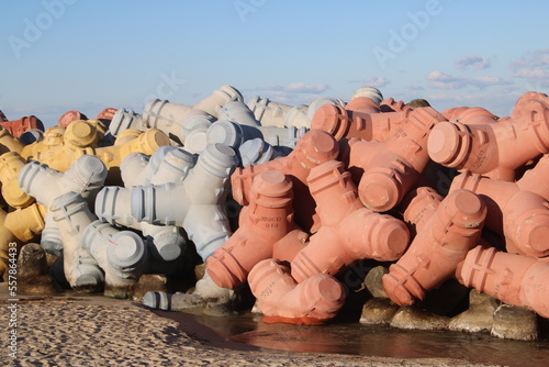 Colorful jetty stones on beach