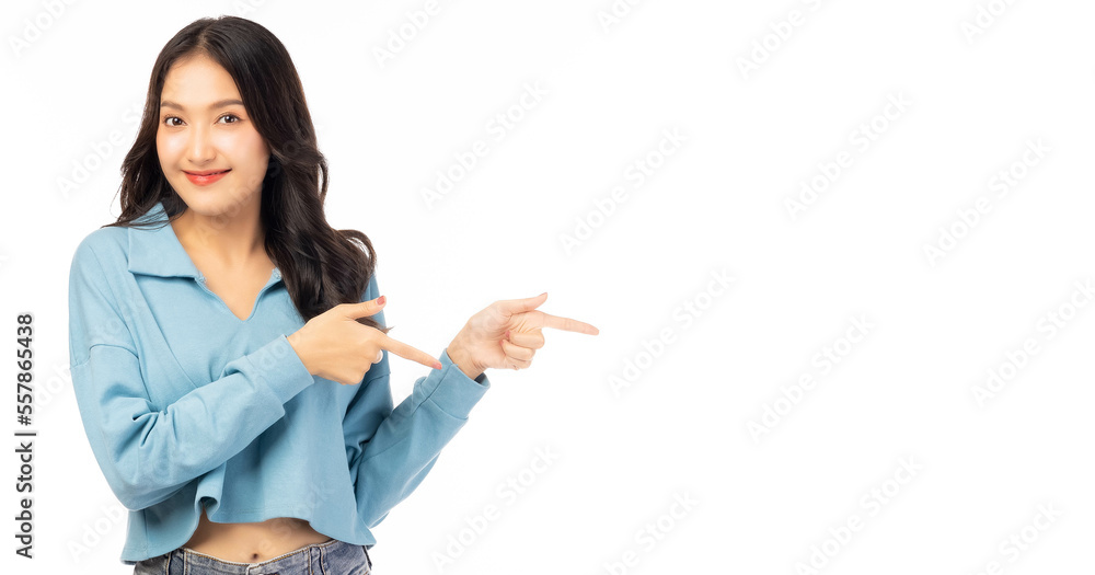 Beautiful young Asian woman pointing up to copy space and looking at camera with smile face and happy Pretty girl act like a satisfied product, use for advertising with isolated on white background Beautiful young Asian woman pointing up to copy space and looking at camera with smile face and happy Pretty girl act like a satisfied product, use for advertising with isolated on white background