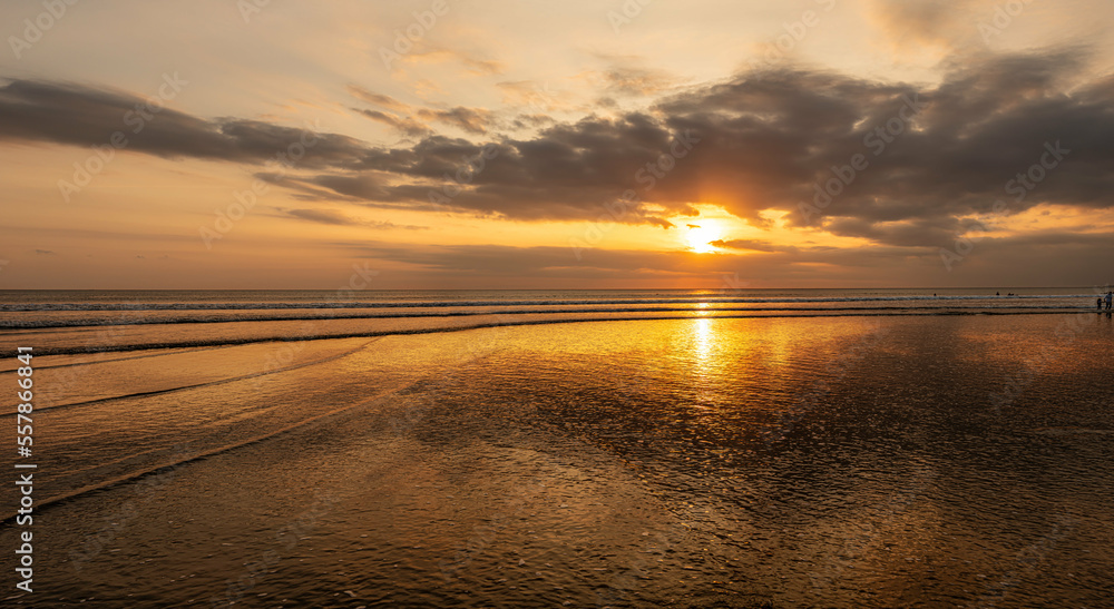 sunset over the sea of Bali Indonesia with reflecting sky sunset over the sea of Bali Indonesia with reflecting sky