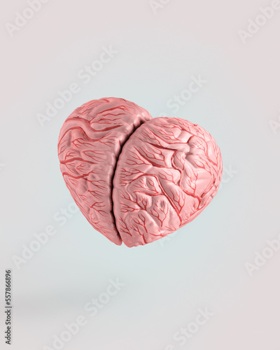 Pink heart-shaped brain on isolated pastel beige background. Minimal surreal abstract creative concept of emotional intelligence or love thoughts. Symbol of love from brain. Valentine’s day card idea.
