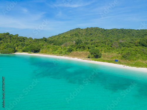 Aerial view of boats with clear blue turquoise seawater, Andaman sea in Phuket island in summer season, Thailand. Water in ocean material pattern texture wallpaper background. © tampatra