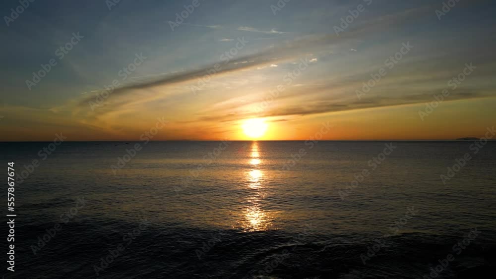 Amazing sunset sky and clouds flowing over tropical sea Amazing sunset sky and clouds flowing over tropical sea