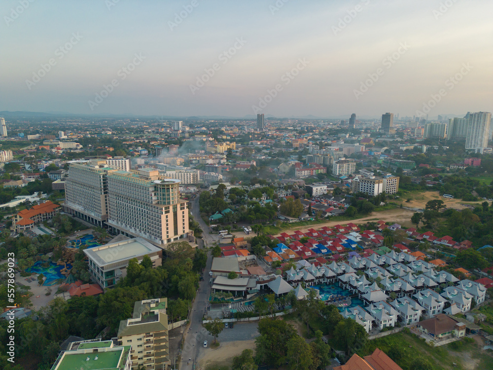 Fototapeta premium Aerial view of Pattaya sea, beach in Thailand in summer season, urban city with blue sky for travel background. Chon buri skyline.