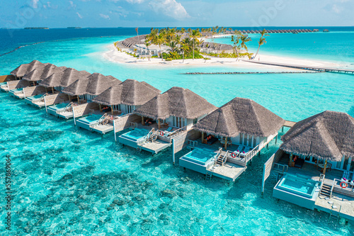 Tranquil aerial travel landscape, luxury tropical resort with pool villas. Beautiful island beach shore, lagoon bay. Amazing bird eyes view in Maldives, paradise coast. Exotic dream tourism relax sea