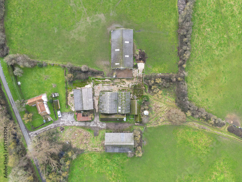 Drone top done view of an old day farm seen in the heart of the English countryside. The hard standing area is we re cattle used to be housed during the winter months.