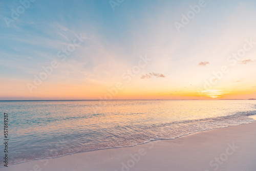 Beautiful sunrise beach. Exotic happy shore waves on bright sand sea horizon. Closeup idyllic Mediterranean dream sunset sky. Peaceful tranquil relax summer colorful clouds. Positive energy meditation © icemanphotos