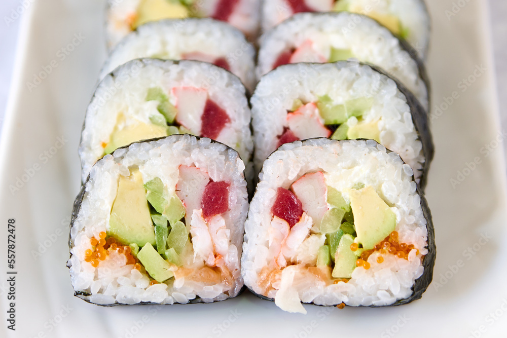 plate with tuna futomaki, rice and avocado plate with tuna futomaki, rice and avocado