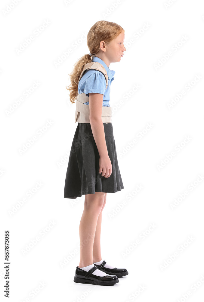 Little schoolgirl in back brace on white background Little schoolgirl in back brace on white background