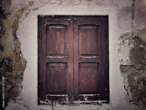 Old retro style wooden window with old cement wall.