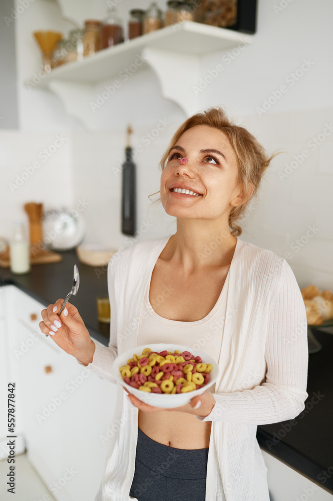 Happy slim woman enjoying dietary delicious food for breakfast Happy slim woman enjoying dietary delicious food for breakfast