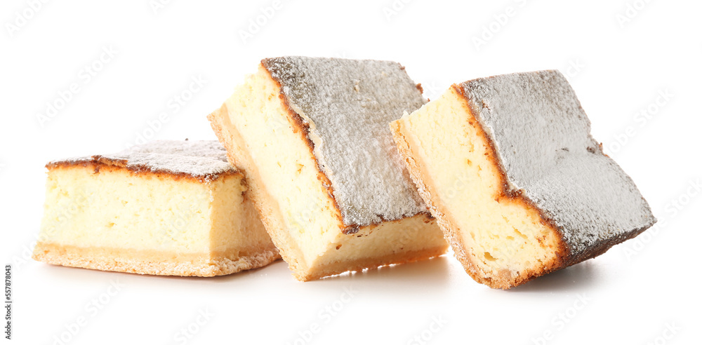 Pieces of delicious cheese pie with sugar powder on white background Pieces of delicious cheese pie with sugar powder on white background