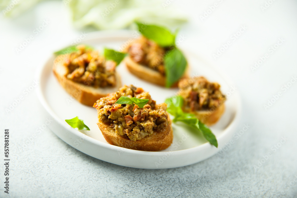 Crostini with olive tapenade and basil Crostini with olive tapenade and basil