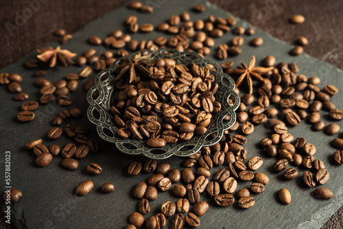 aromatic roasted coffee beans with spices, anise and metal turkish bowl on black background 2