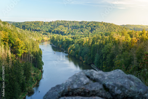 Fototapeta Naklejka Na Ścianę i Meble -  Slow river in rocks at sunny autumn