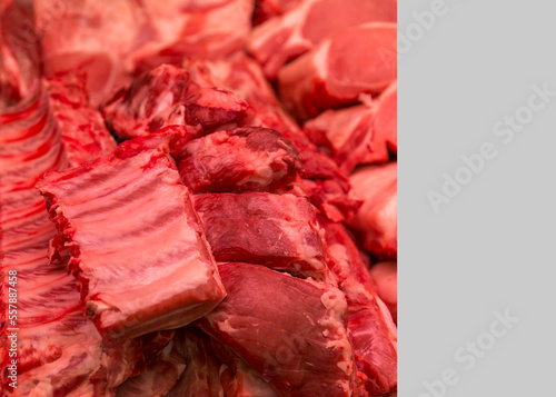 Raw meat ribs on the counter. Healthy food. Close-up. Space for text on a light gray background.