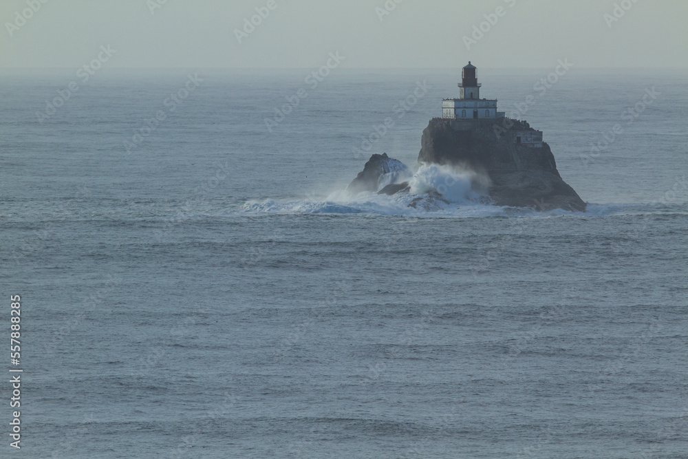 Tillamook Head Lighthouse - A lighthouse on a rock island on the pacific ocean.