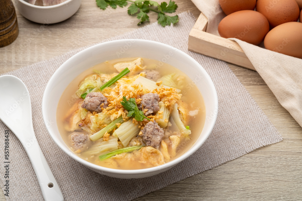 Clear soup with fried egg and minced pork ,Chinese Cabbage in white bowl Clear soup with fried egg and minced pork ,Chinese Cabbage in white bowl