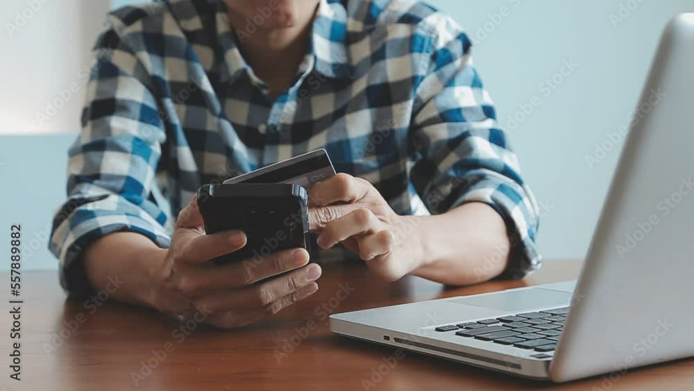 Hands holding credit card and using laptop. Online shopping Hands holding credit card and using laptop. Online shopping