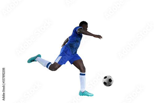 Football striker with blue team suit chases the soccerball photo