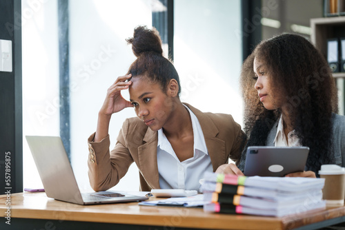 An African American businesswoman participates in a staff meeting and working together at workplace.