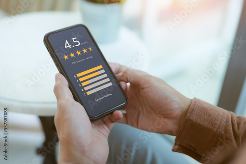 User comment and give excellent rating to service experience on online application, User evaluate quality of service reputation ranking of business. Customer satisfaction feedback survey concept, photo