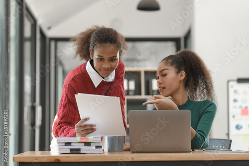 African American girls students studying up for test or making homework together, Back to school concept.