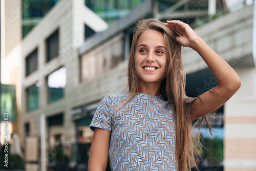 Portrait of beautiful young woman on city street © New Africa