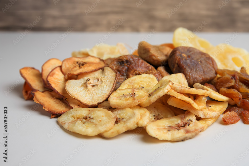 Pile of different dried fruits on white background, closeup Pile of different dried fruits on white background, closeup