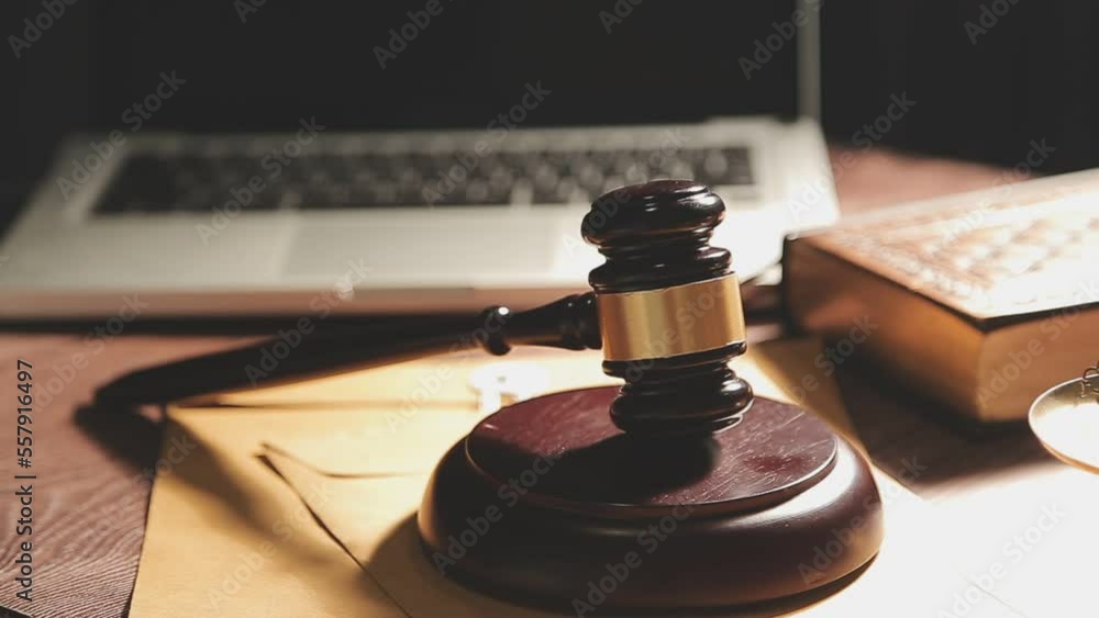Business and lawyers discussing contract papers with brass scale on desk in office. Law, legal services, advice, justice and law concept picture with film grain effect Business and lawyers discussing contract papers with brass scale on desk in office. Law, legal services, advice, justice and law concept picture with film grain effect