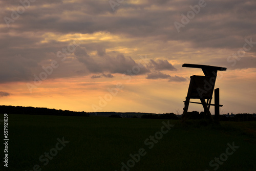 Silhouette of a deer stand for hunting in the sunset