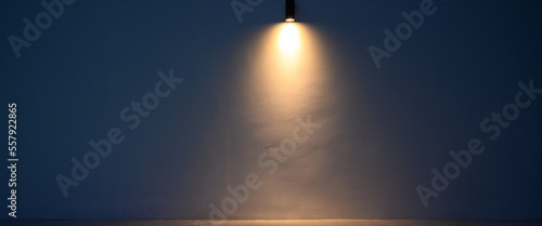 Fotografie Glowing modern wall led lamp with warm light on white wall